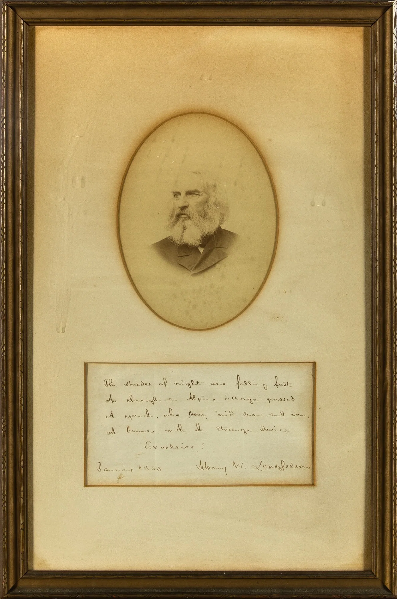 A signed Longfellow quotation from the opening stanza of Excelsior