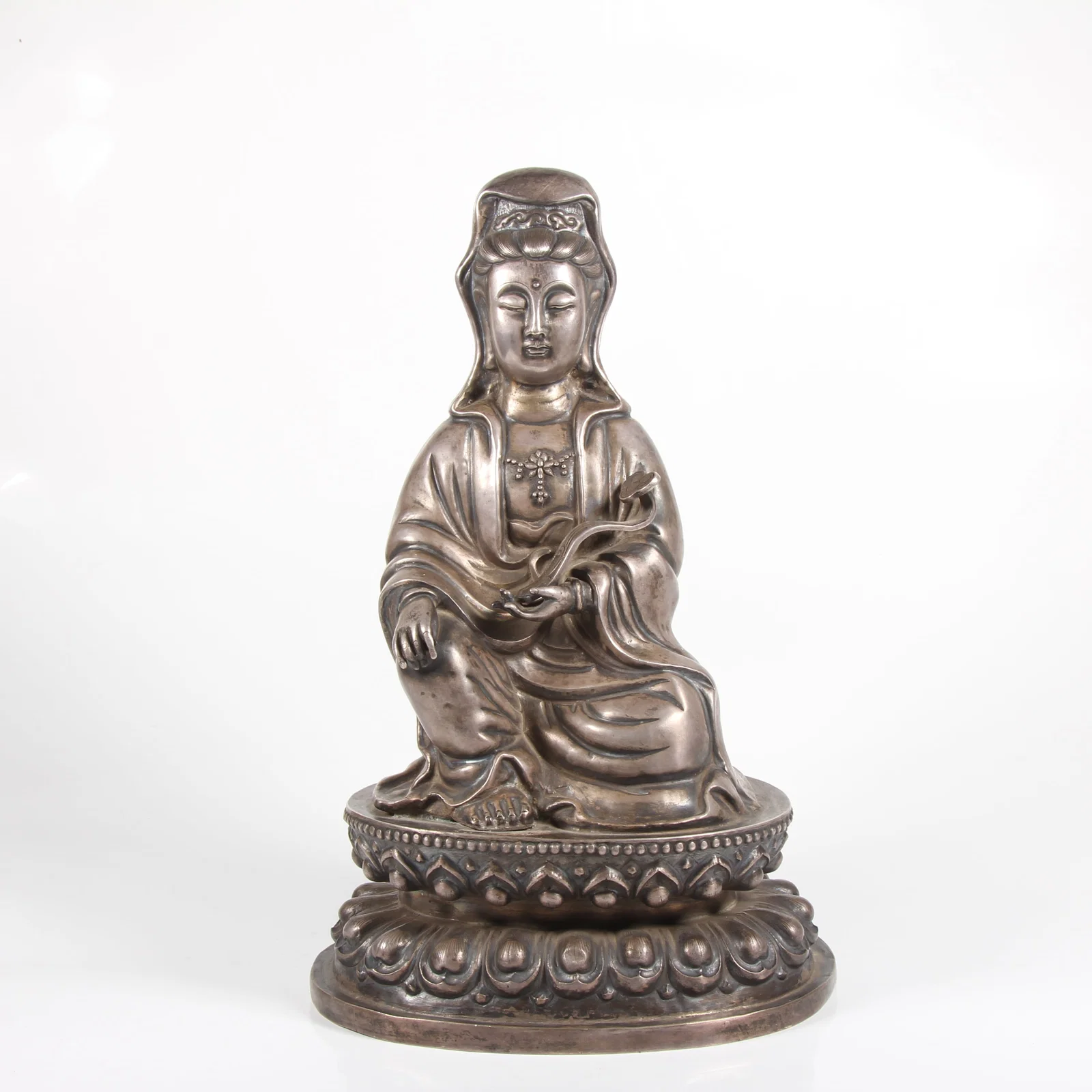 A SILVER GUANYIN STATUE