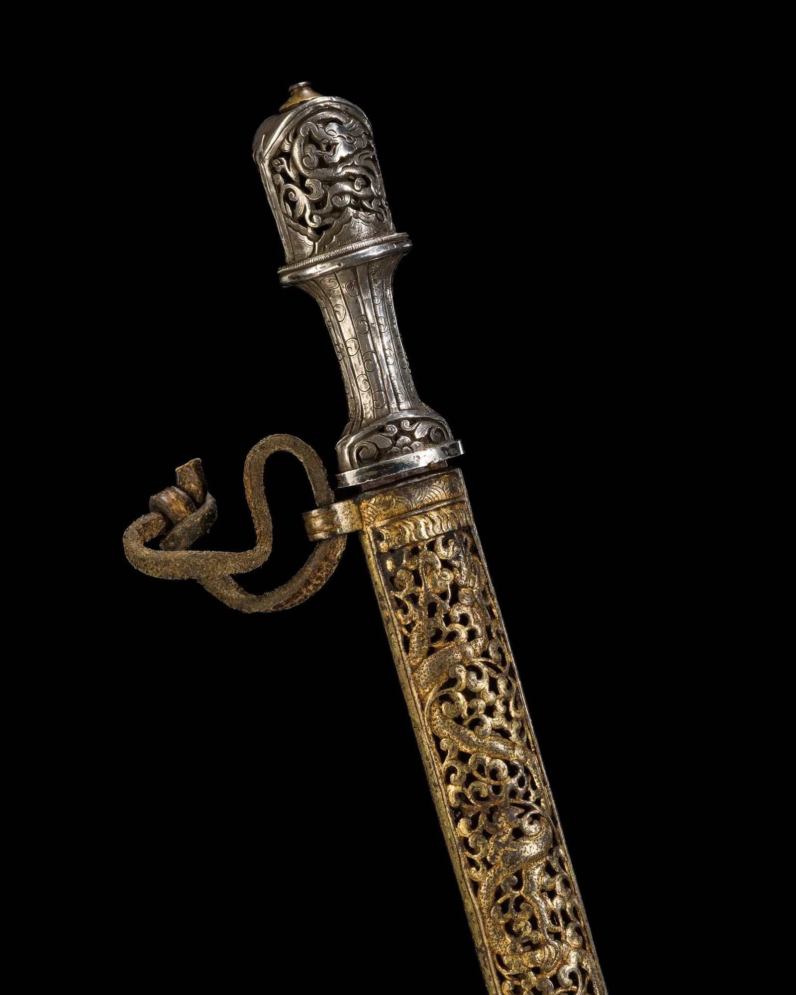 A SILVER-HILTED IRON DAGGER WITH SILVER- AND GILT-DAMASCENED IRON SCABBARD, TIBET, 18TH-19TH CENTURY