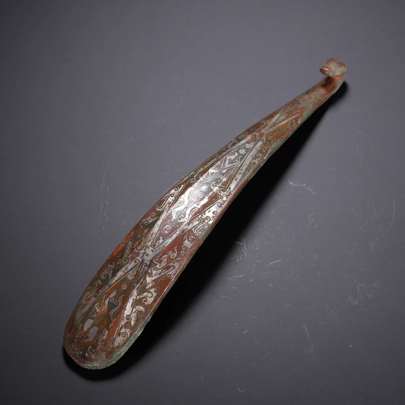 A SILVER INLAID BRONZE BELTHOOK