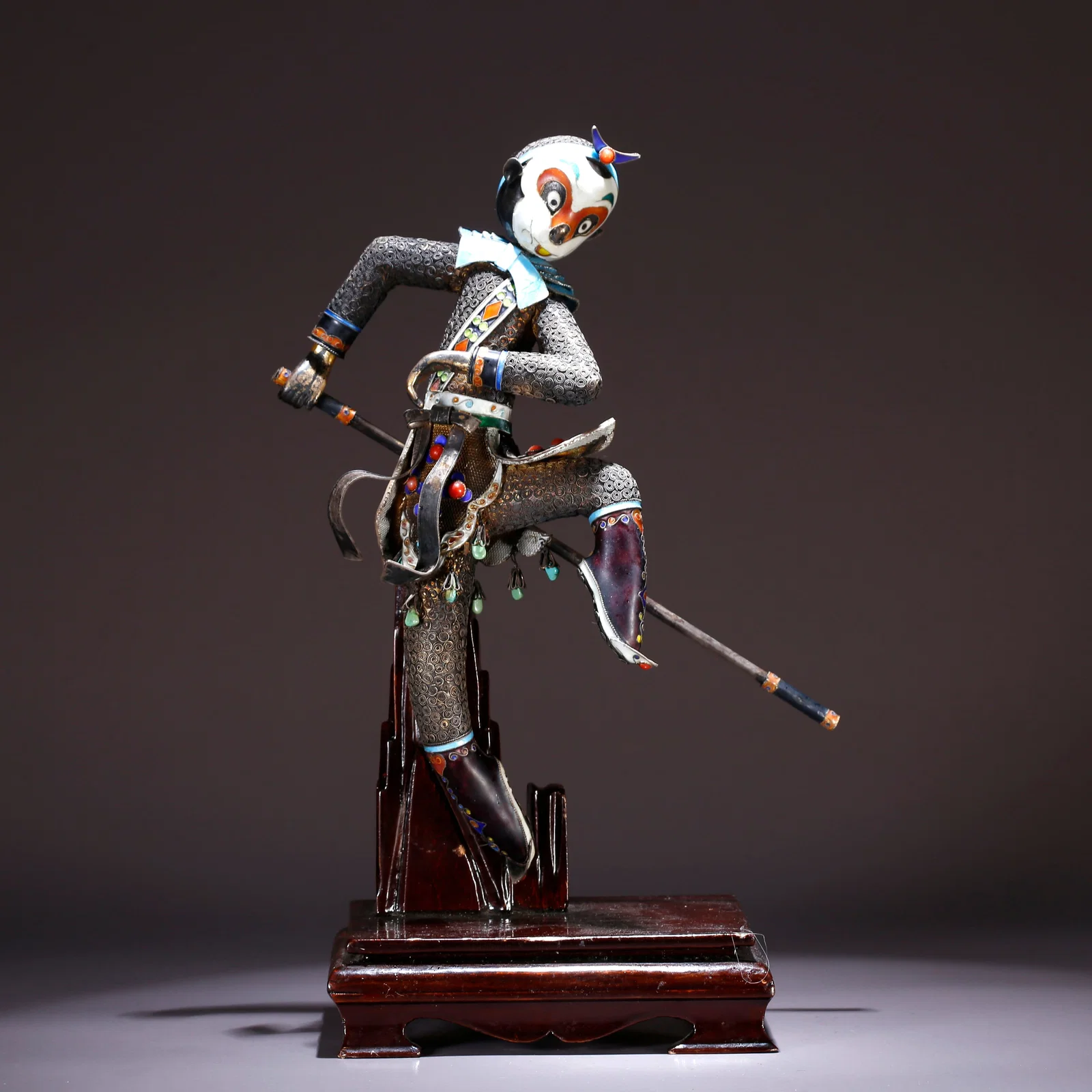 A SILVER-PAINTED FIGURE OF SUN WUKONG ORNAMENT