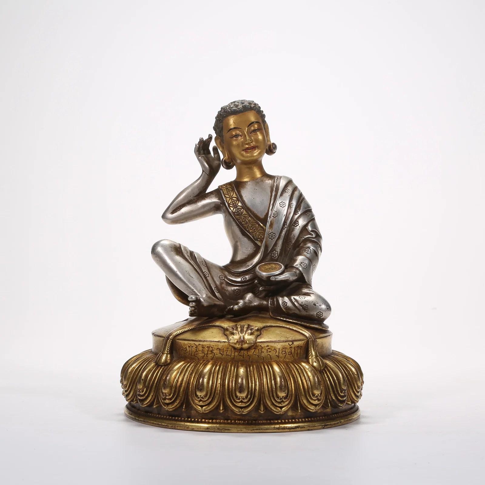 A SILVER STATUE OF MILAREPA
