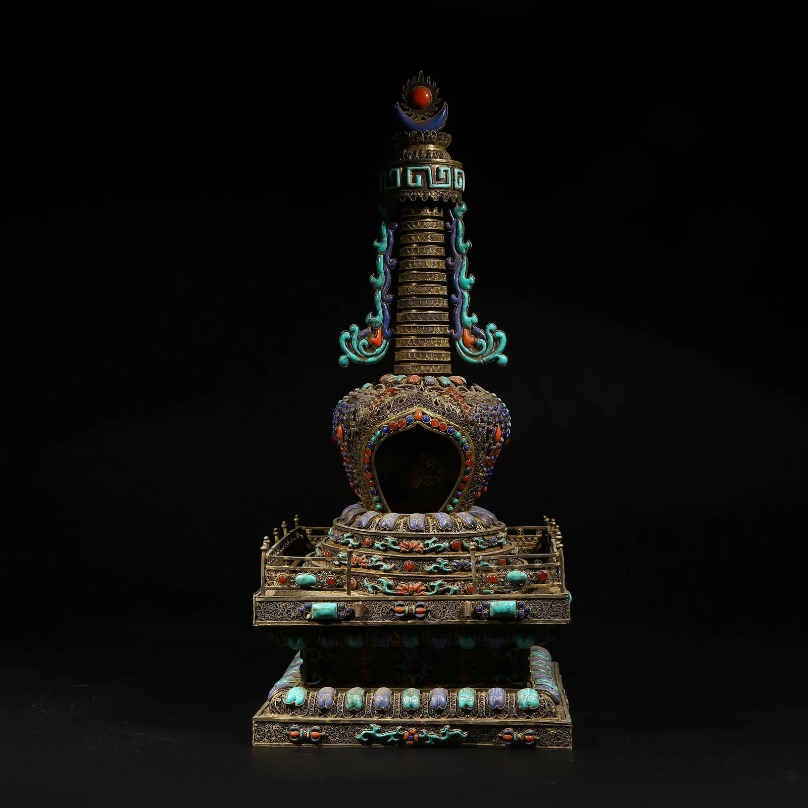 A SILVER STUPA INLAID WITH GEMS