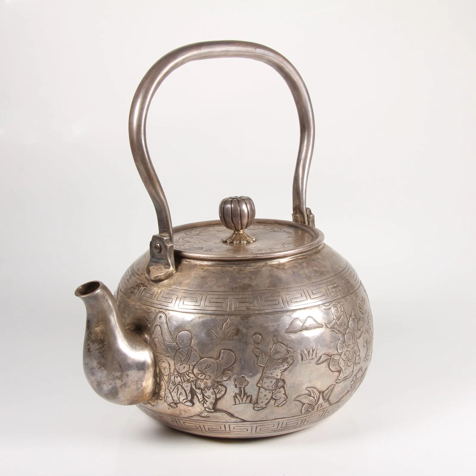 A SILVER TEAPOT WITH HUNDRED CHILDREN MOTIF