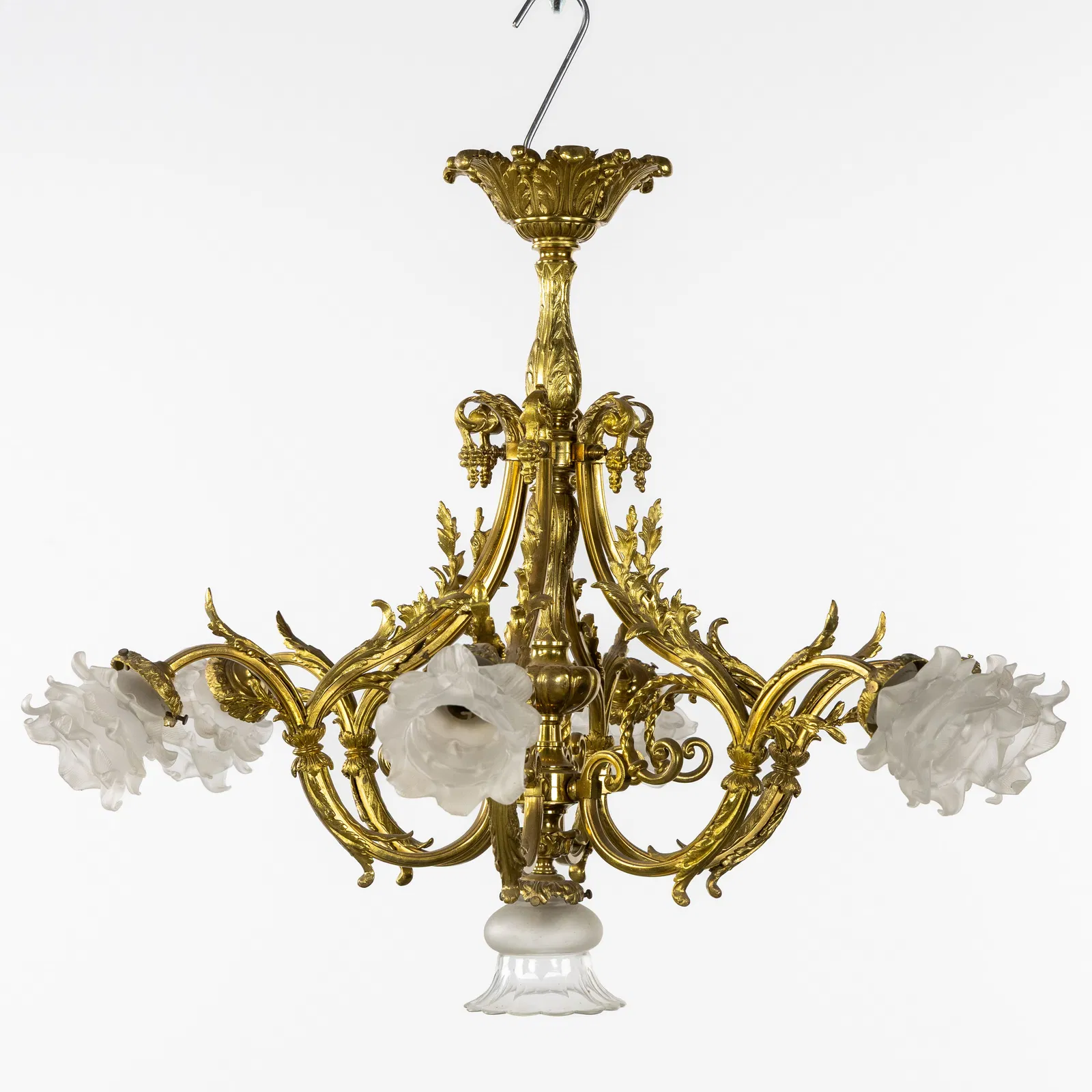 A Six-armed Chandelier, gilded bronze, mounted with frosted glass.