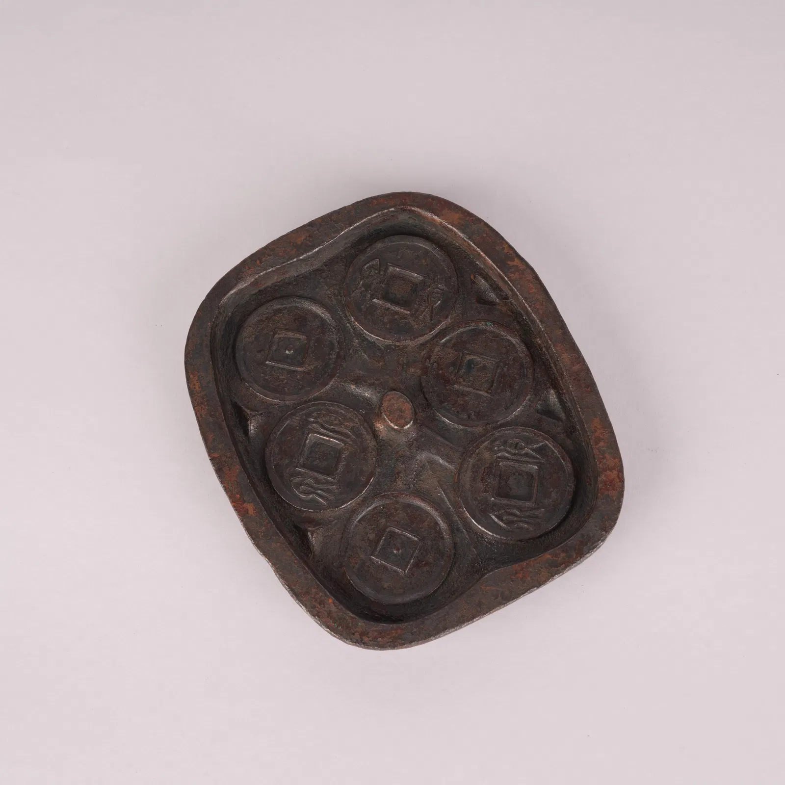 A SIX COIN MOLDS FROM THE XIN–MANG PERIOD