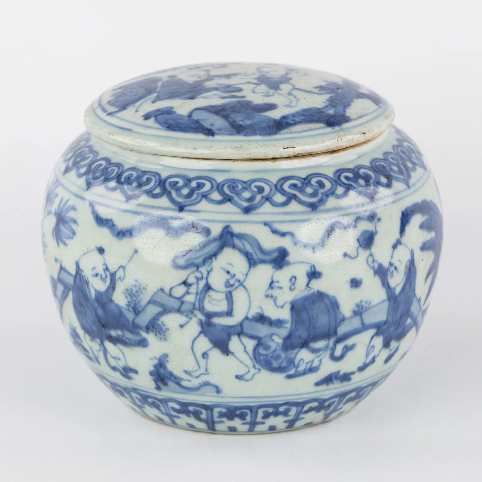 A Small Covered Jar, decorated in blue and white with 'Playful Boys', Ming style.