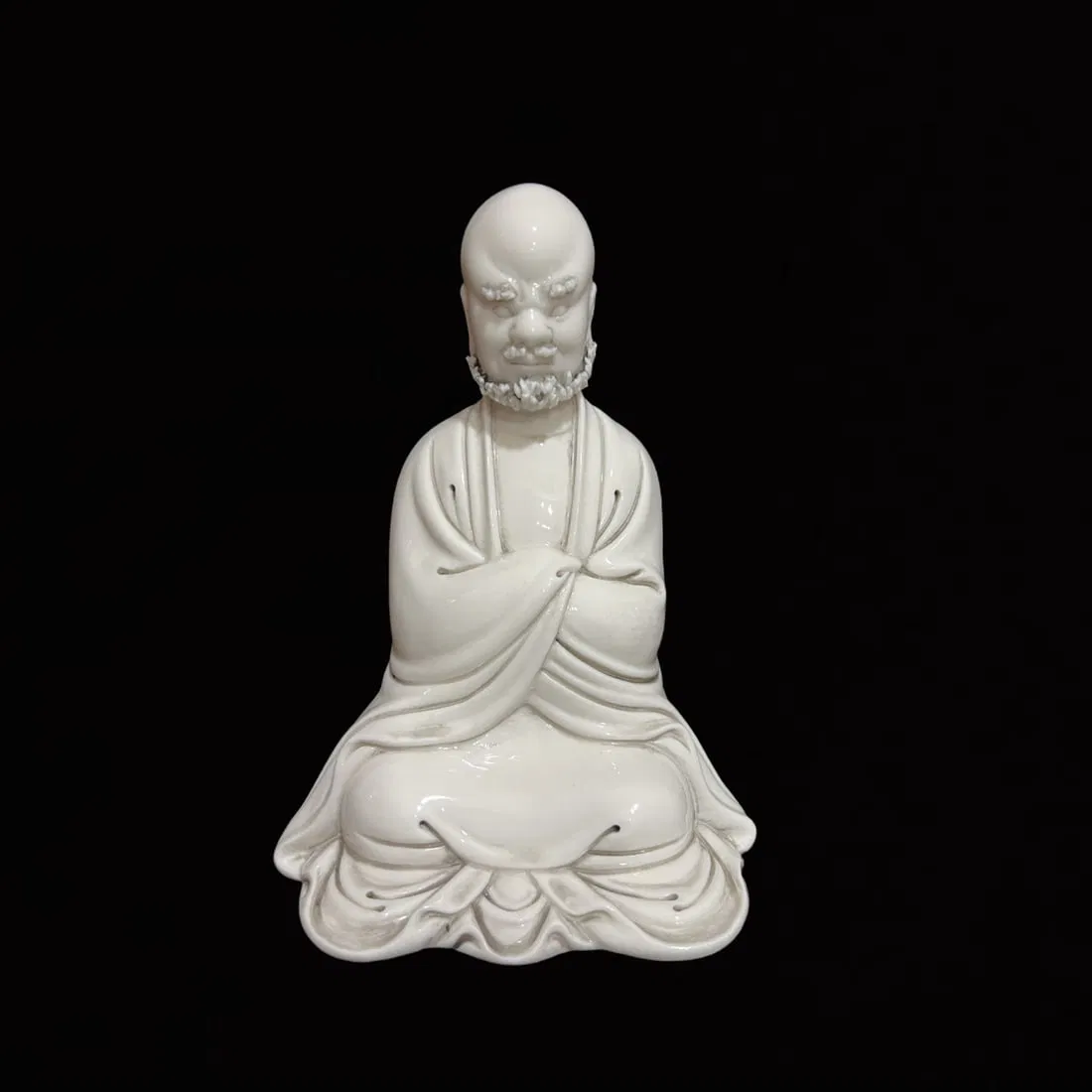 A Solemn Blance-De-Chine Statue of Dharma