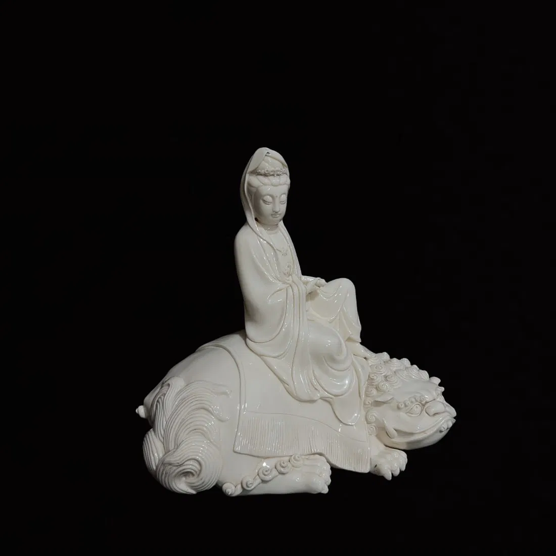 A Solemn Blance-De-Chine Statue of Manjusri