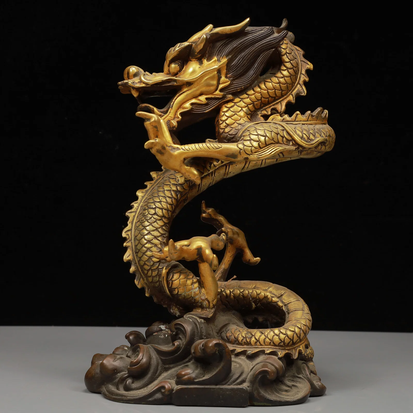 A Solemn Gilt Bronze Dragon Ornament