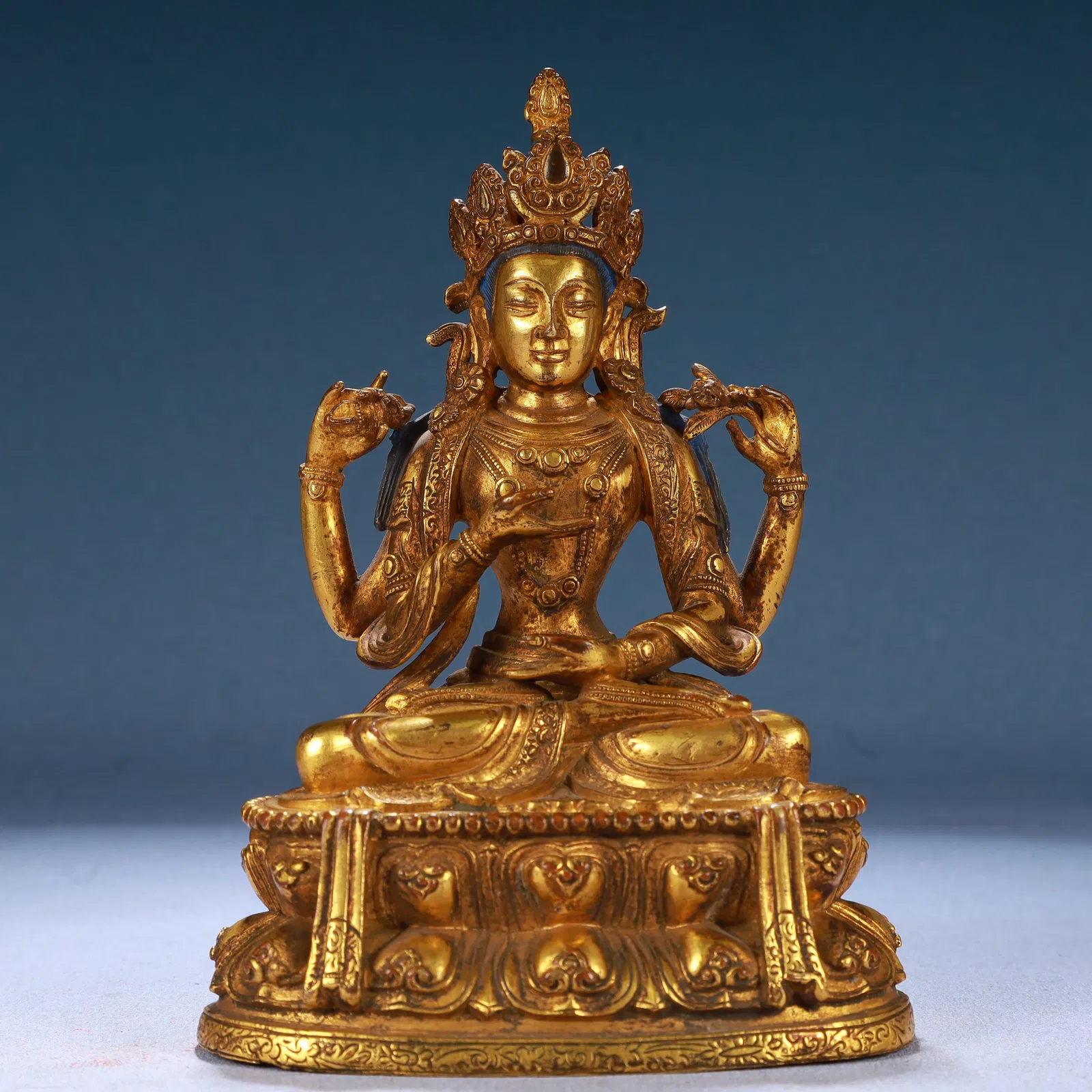 A Solemn Gilt Bronze Four-arms Statue of Avalokitesvara