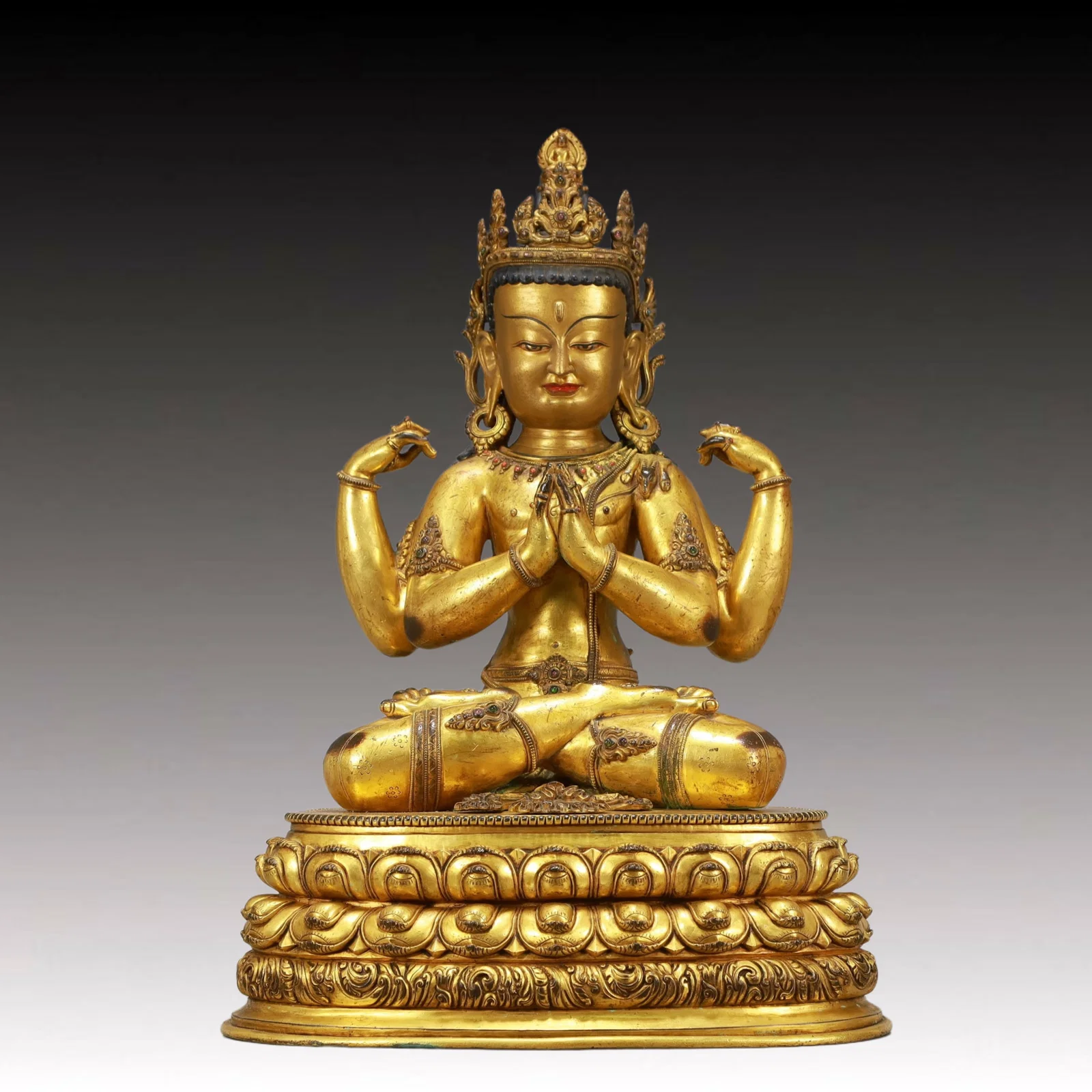 A Solemn Gilt Bronze Statue of Four-arms Guanyin