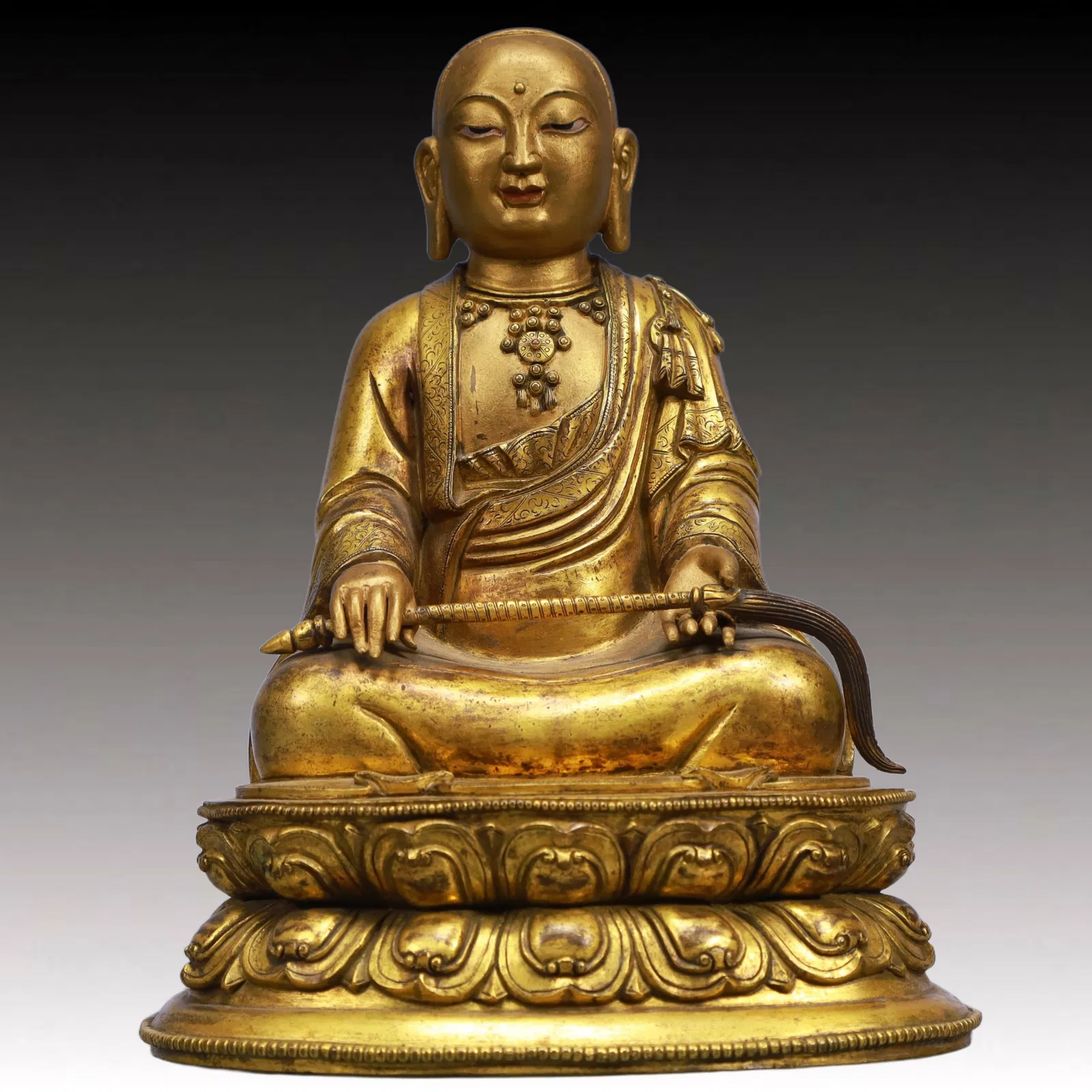 A Solemn Gilt Bronze Statue of Guru
