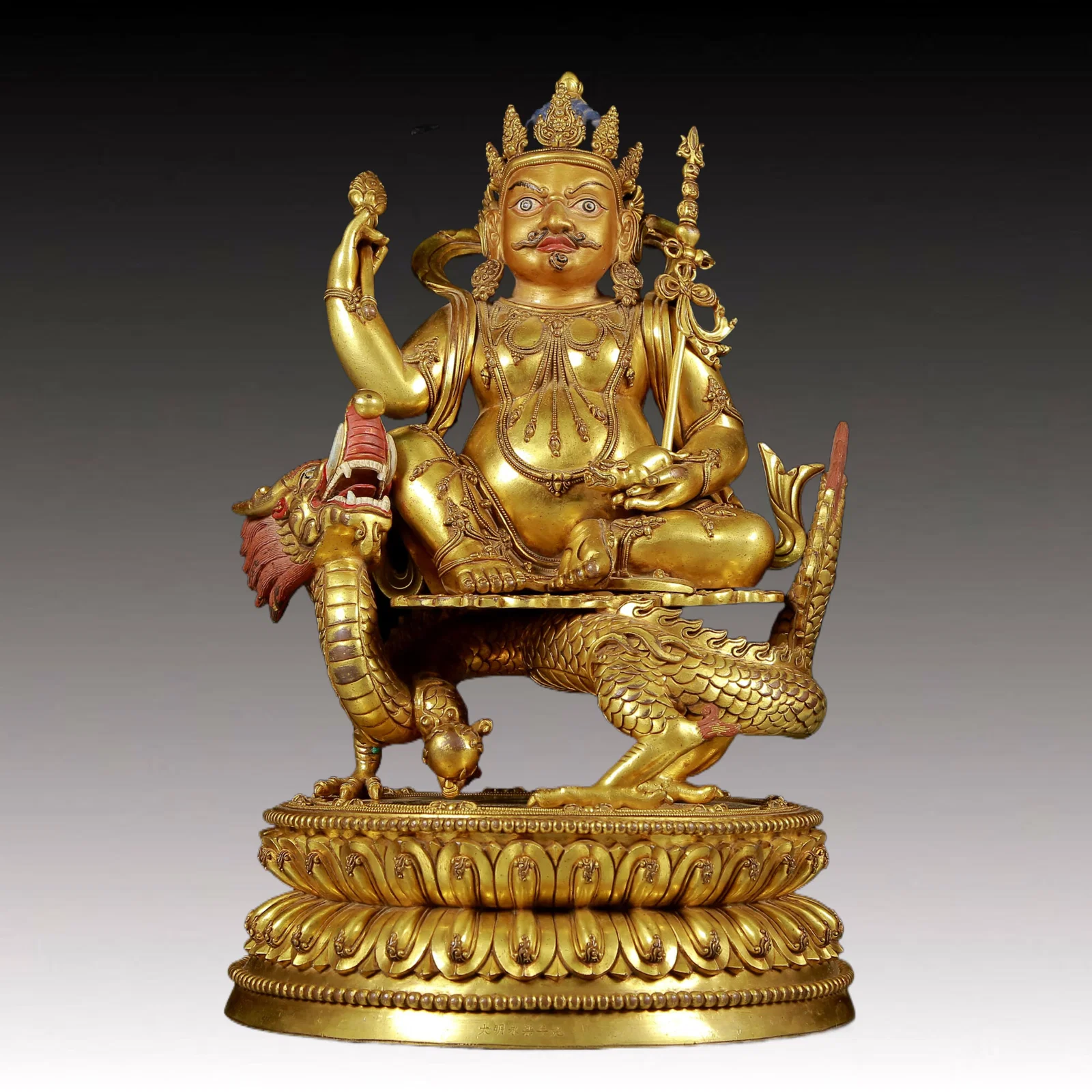 A solemn gilt bronze statue of Mammon