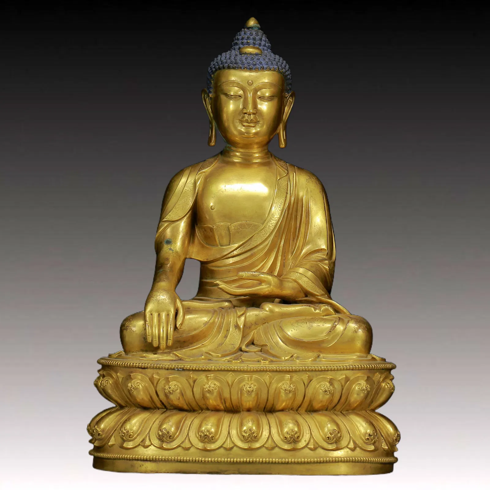 A Solemn Gilt Bronze Statue of Sakyamuni