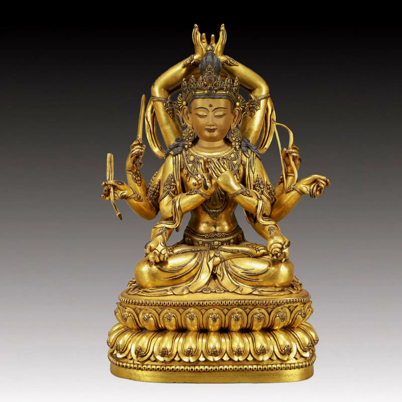 A Solemn Gilt Bronze Statue of Ten-Armed Guanyin