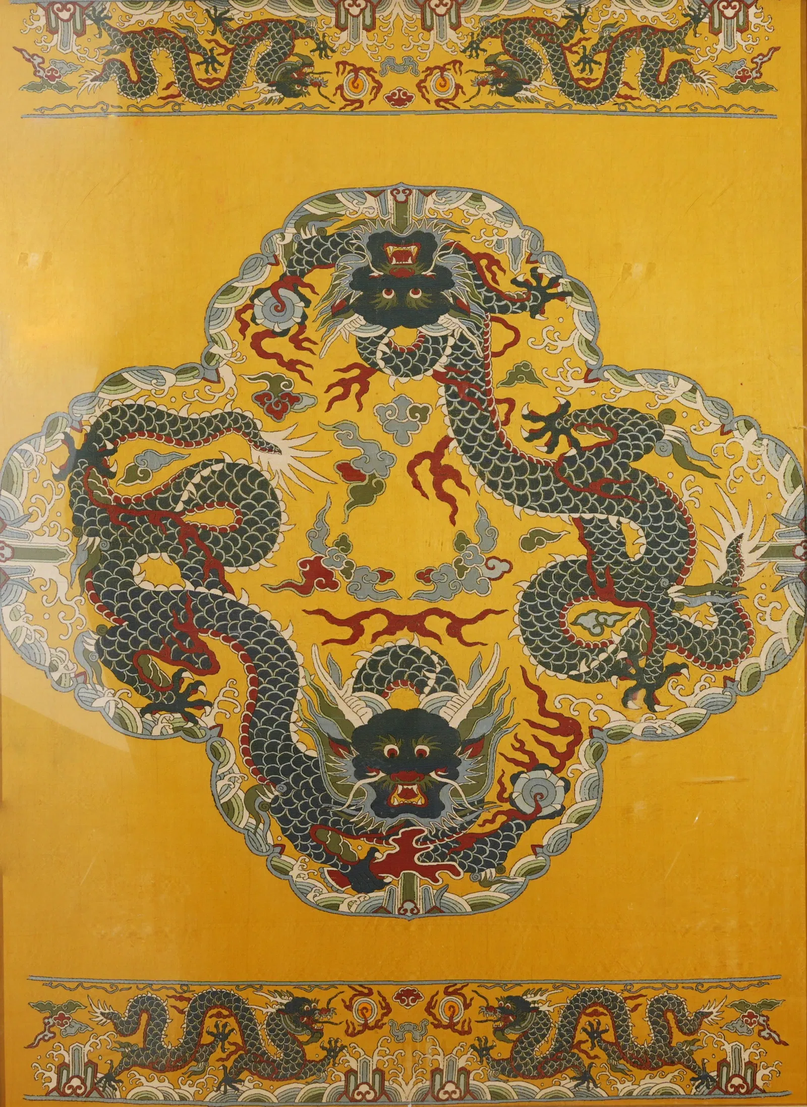 A SONG BROCADE HANGING SCREEN WITH CLIFF SEA AND DRAGON MOTIF.