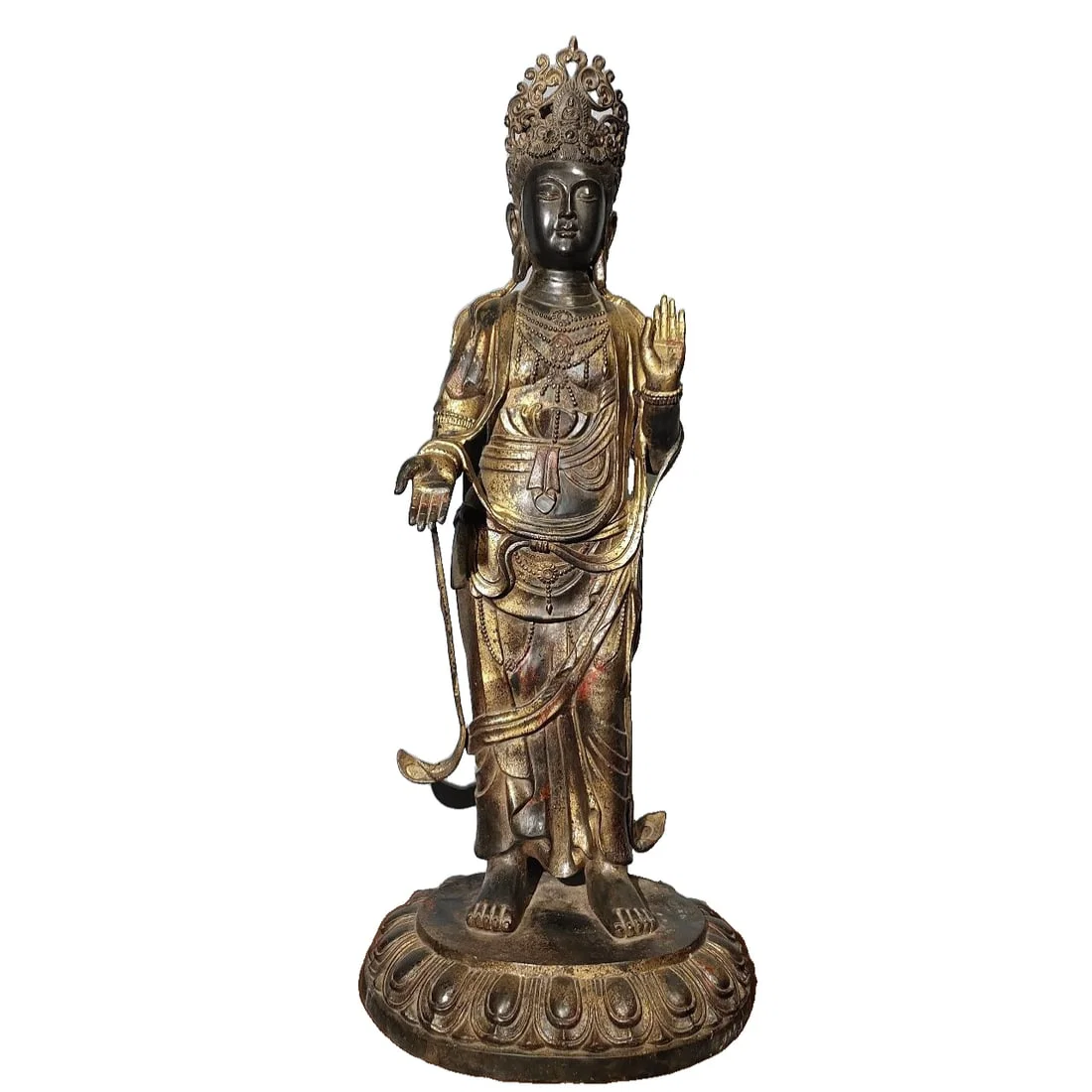 A statue of Guanyin Bodhisattva in pure copper with gold foil.