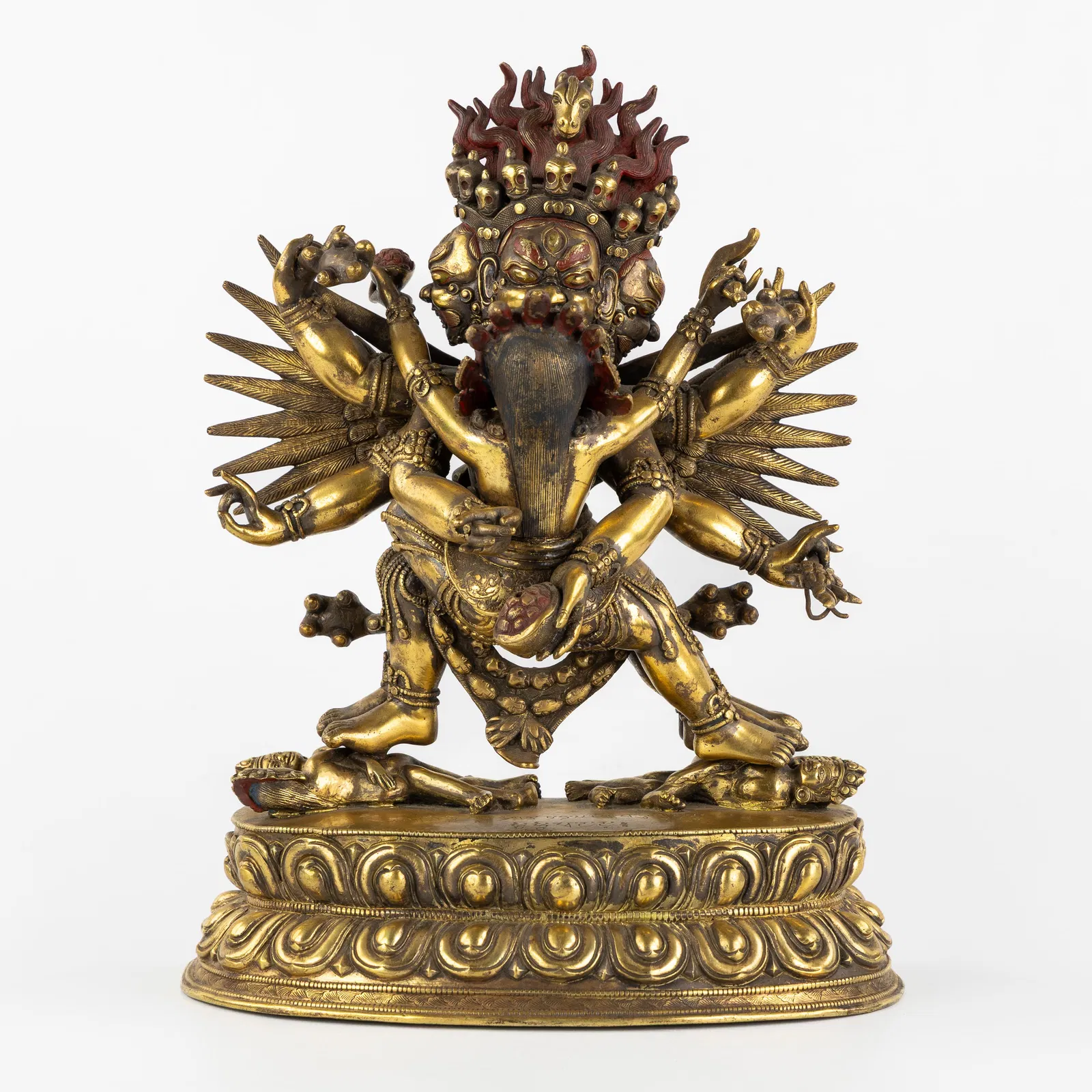 A Statue of Hayagriva and his consort Vajravarahi in Yab-Yum, gilded and patinated bronze, 19th C.