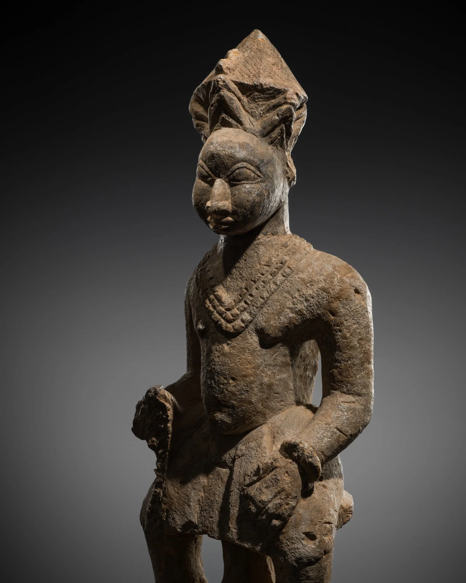 A STONE ANCESTOR FIGURE, ESIE, IGBOMINA, 18TH CENTURY