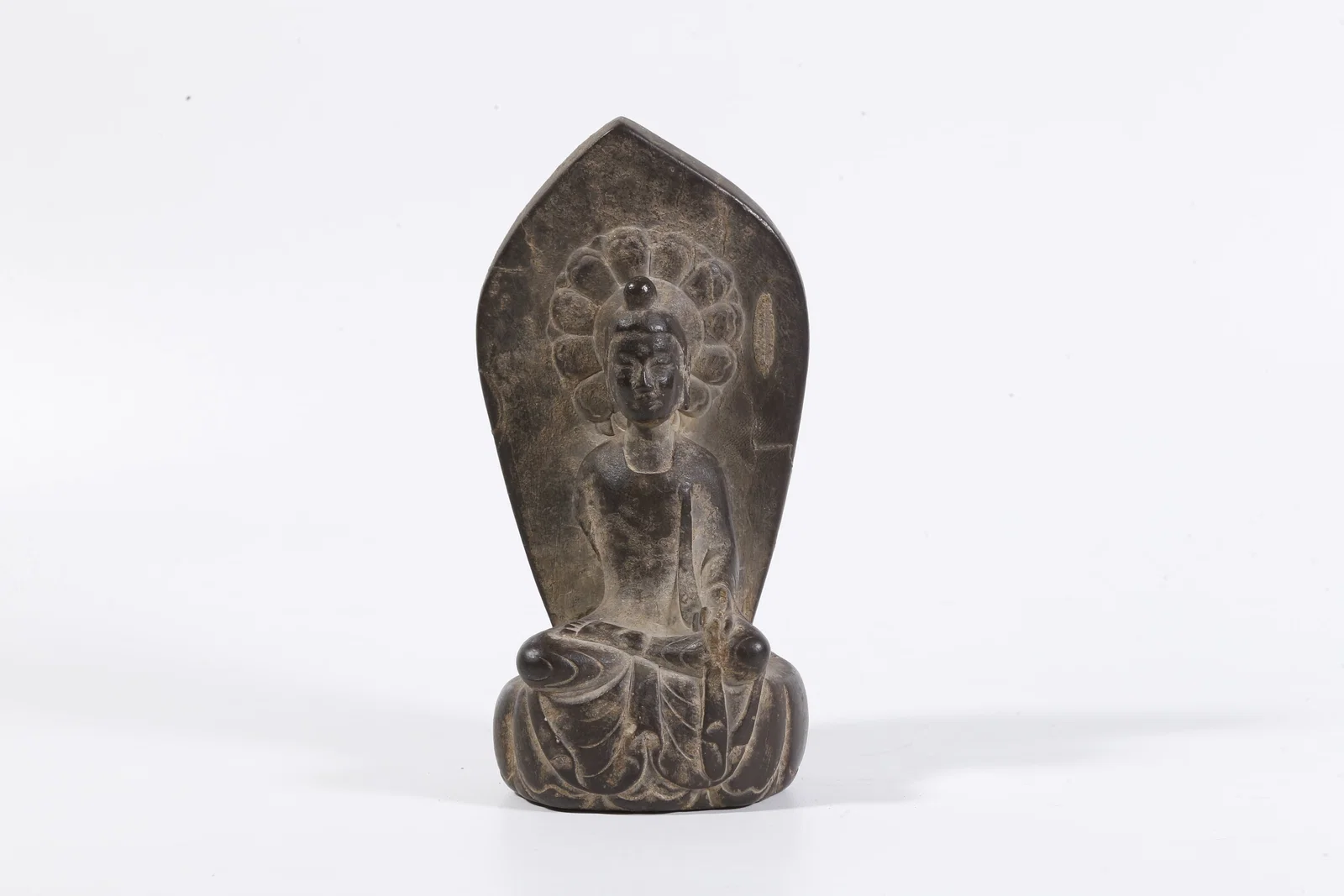 A STONE CARVED BUDDHA FIGURE