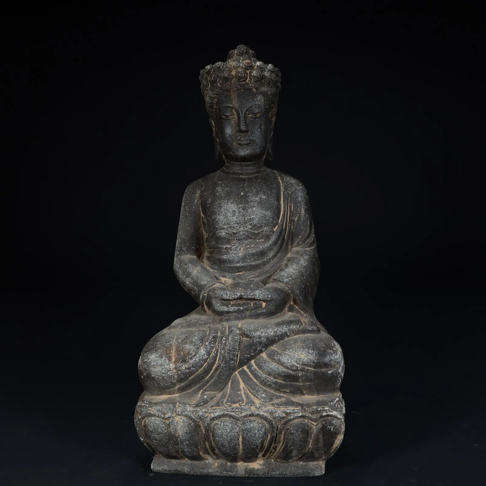 A stone "sitting Buddha" statue of the Ming Dynasty