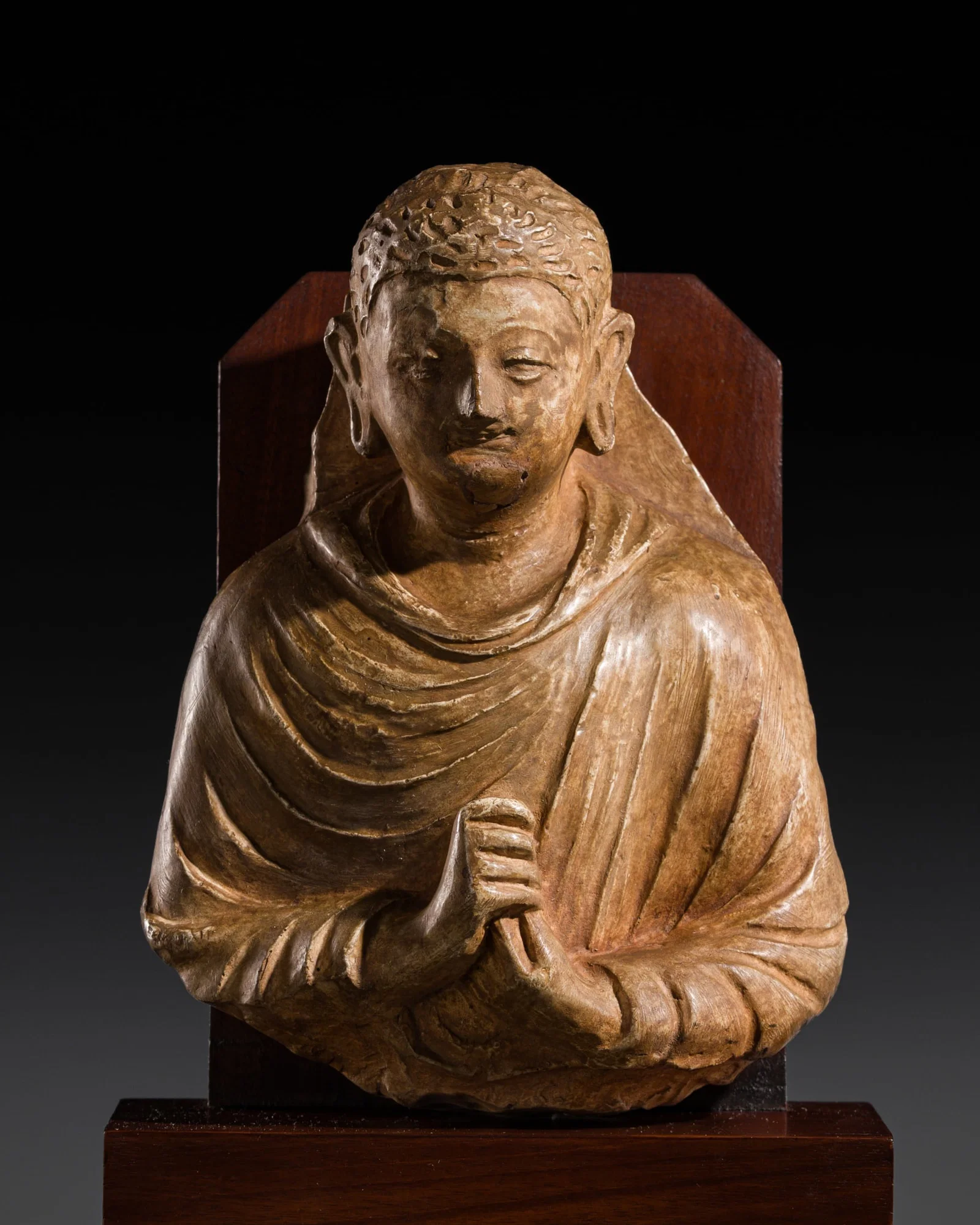 A STUCCO BUST OF BUDDHA, ANCIENT REGION OF GANDHARA, 3RD-5TH CENTURY