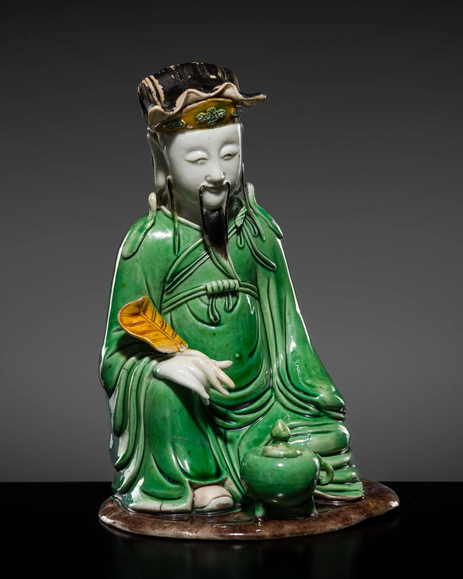 A SUPERB FAMILLE VERTE BISCUIT PORCELAIN FIGURE OF LU DONGBIN, EARLY KANGXI PERIOD