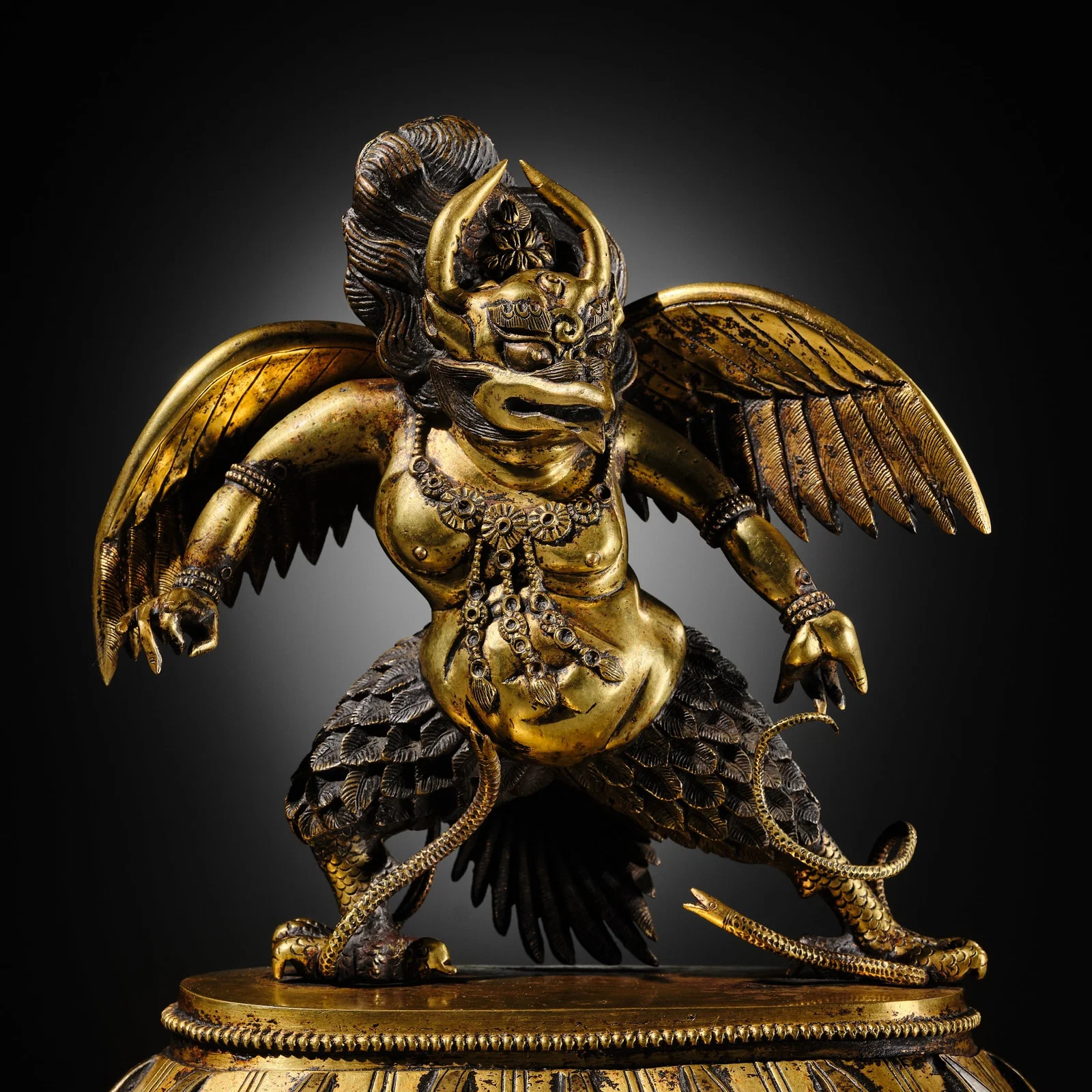 A SUPERB GILT BRONZE FIGURE OF GARUDA, TIBETAN-CHINESE, 17TH-18TH CENTURY