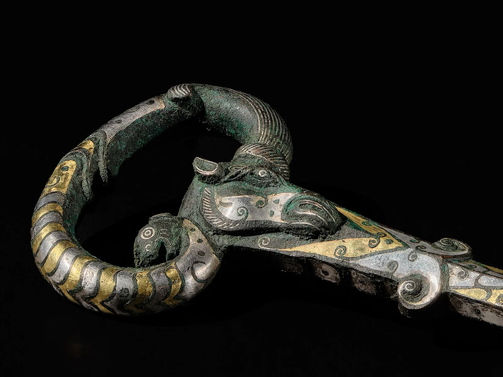 A SUPERB GOLD AND SILVER INLAID 'RAM AND TIGER' TUNING KEY, QIN ZHEN YAO, WARRING STATES PERIOD