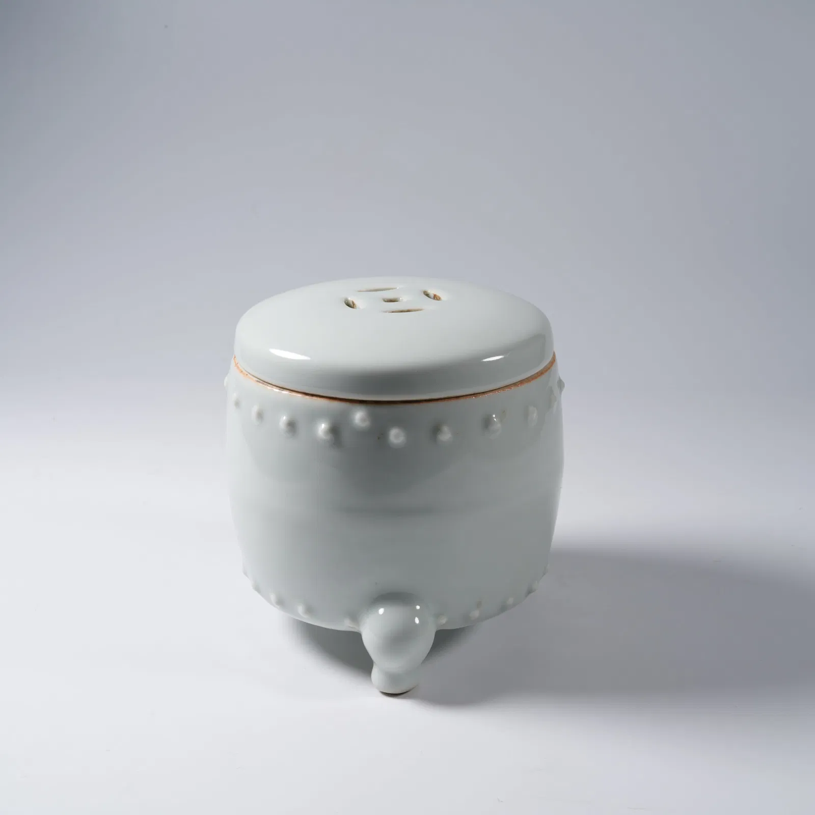 A SWEET-WHITE GLAZED TRIPOD INCENSE BURNER