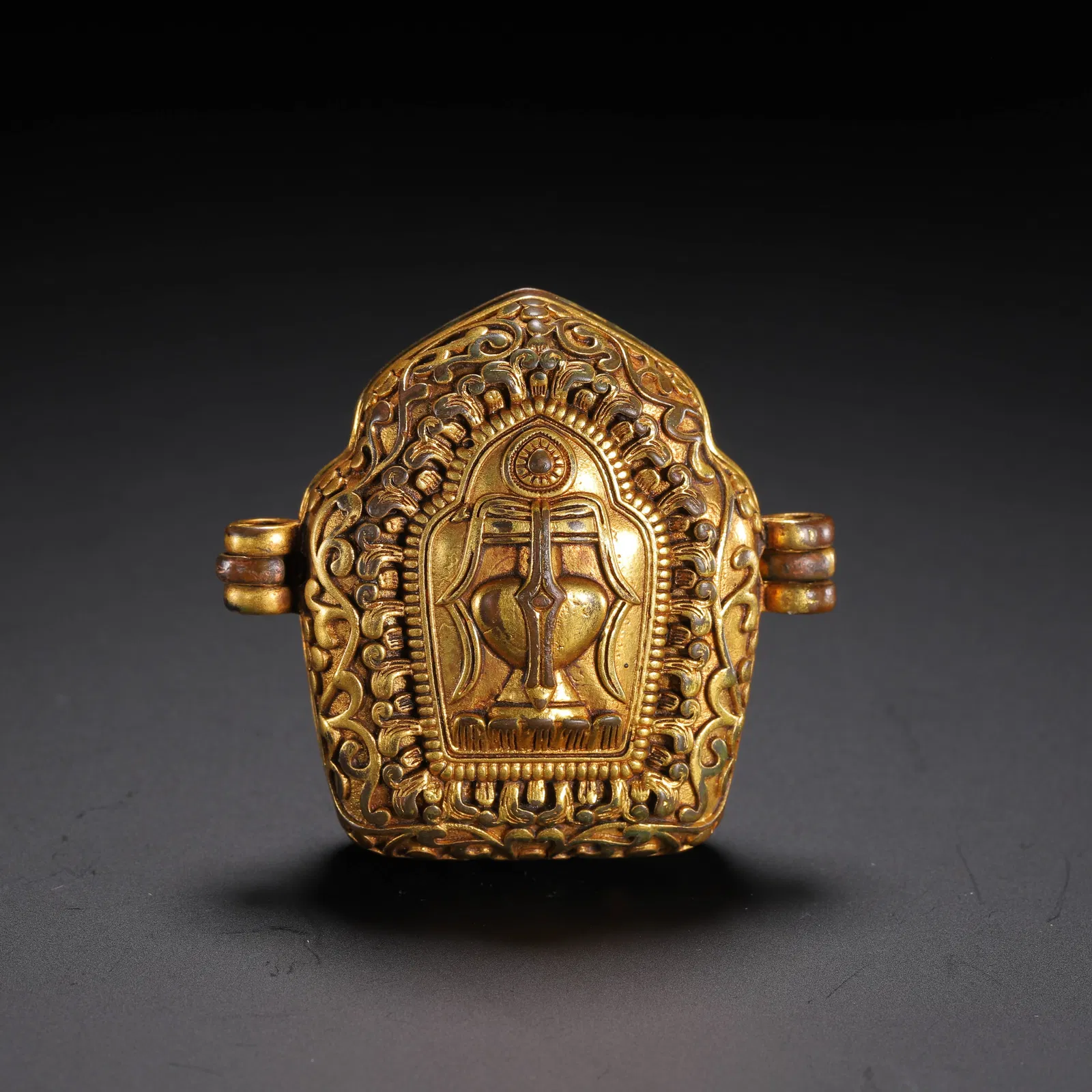 A TIBETAN BRONZE-GILT AMULET BOX