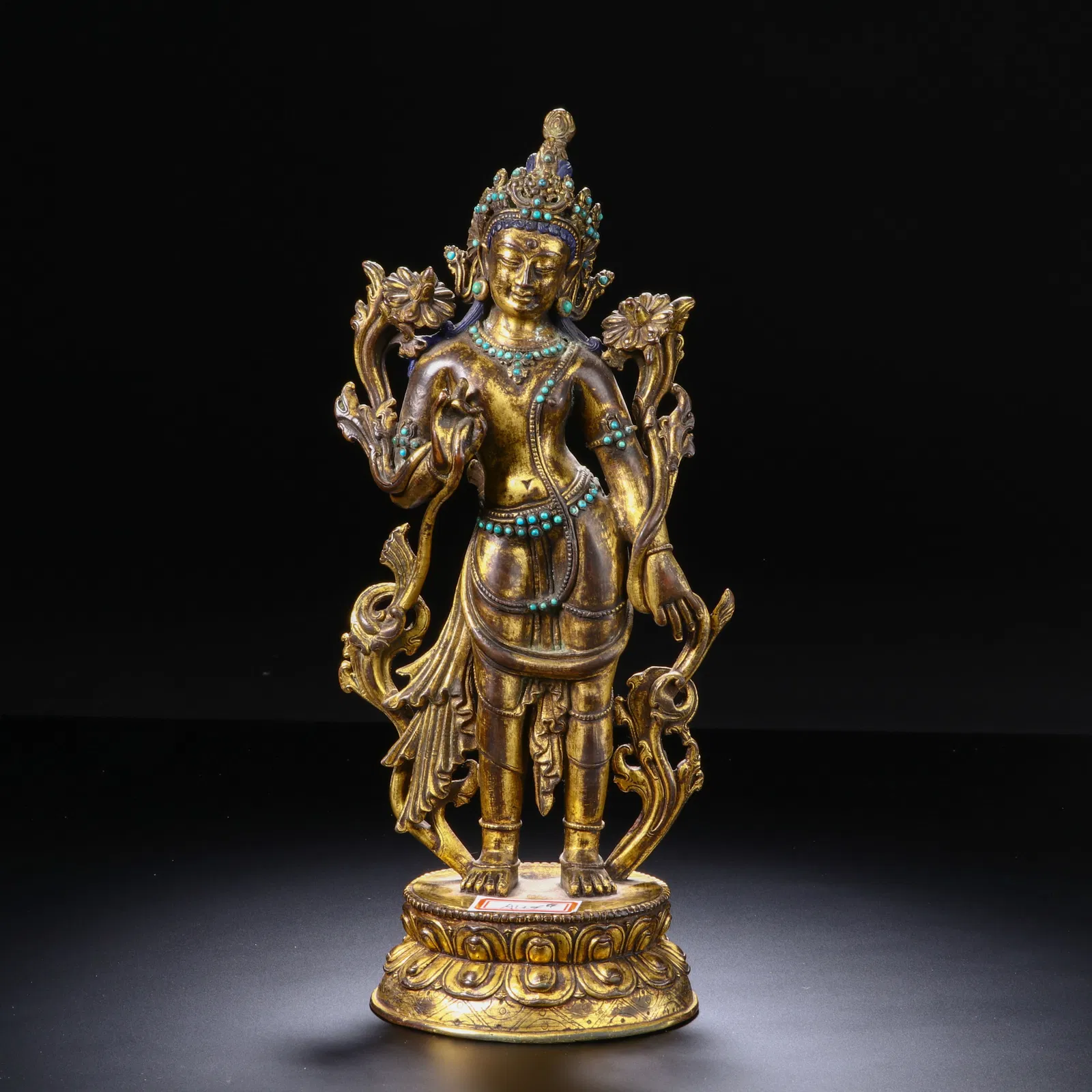 A TIBETAN BRONZE-GILT STANDING PADMAPANI