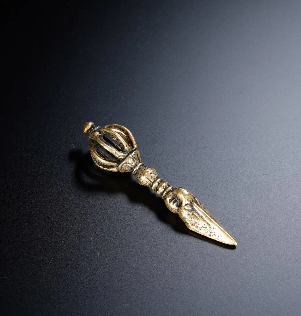 A TIBETAN BRONZE PHURBA