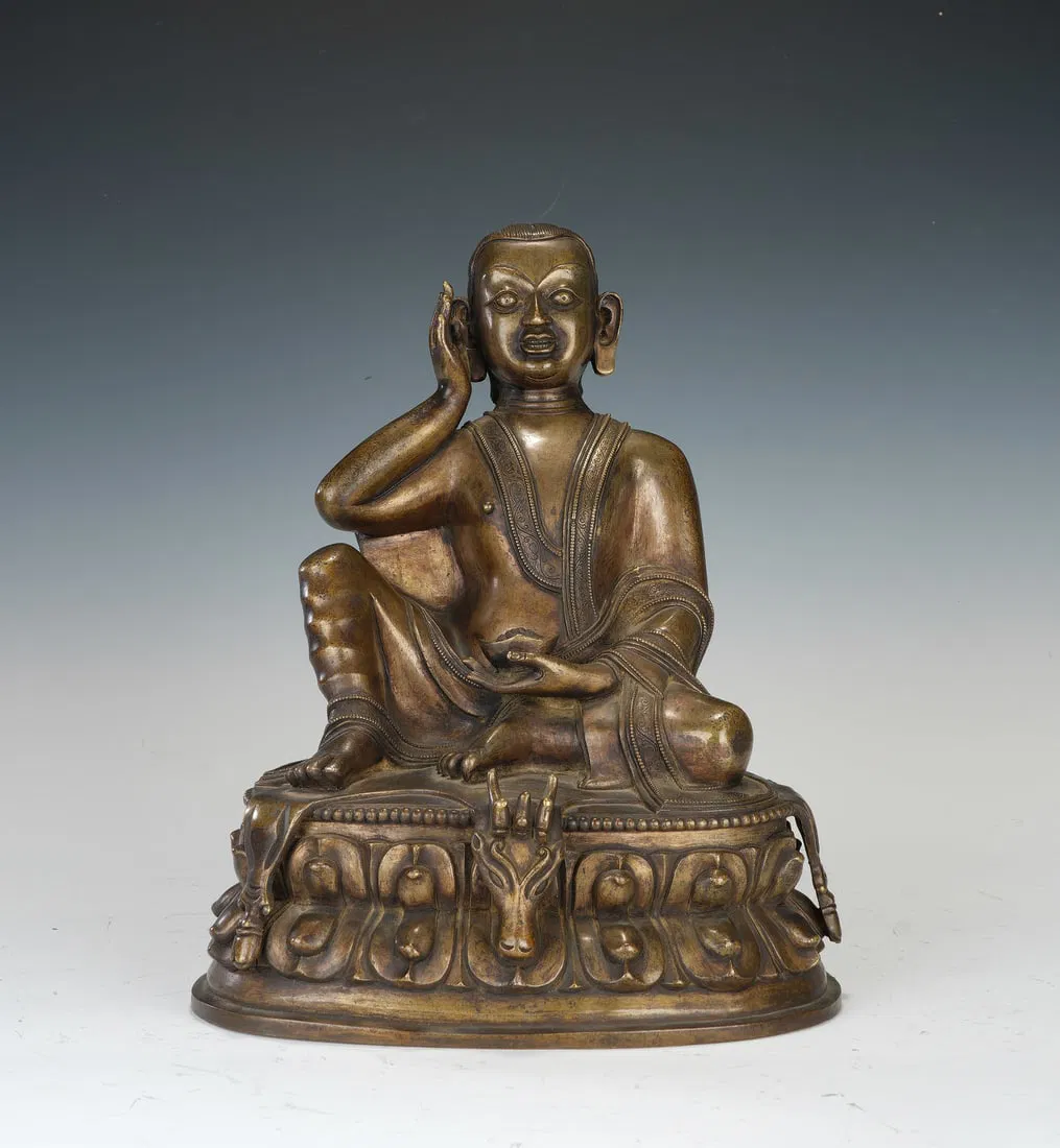 A TIBETAN COPPER ALLOY SEATED MILAREPA