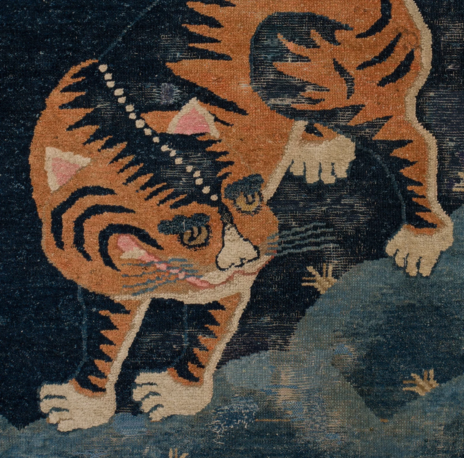 A 'TIGER' WOOL RUG, BAOTU, CHINA, LATE QING DYNASTY, 19TH - EARLY 20TH CENTURY