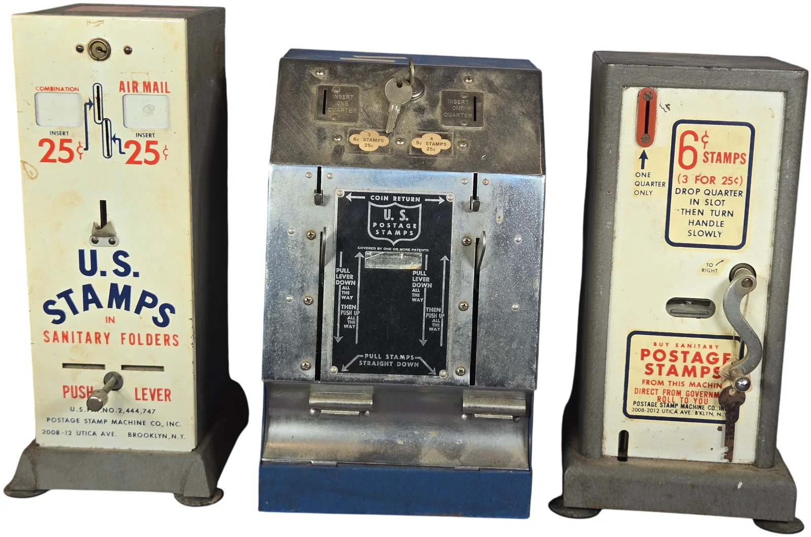 A Trio of Vintage Postage Stamp Machine Co. Inc. Mechanical Vending Machines