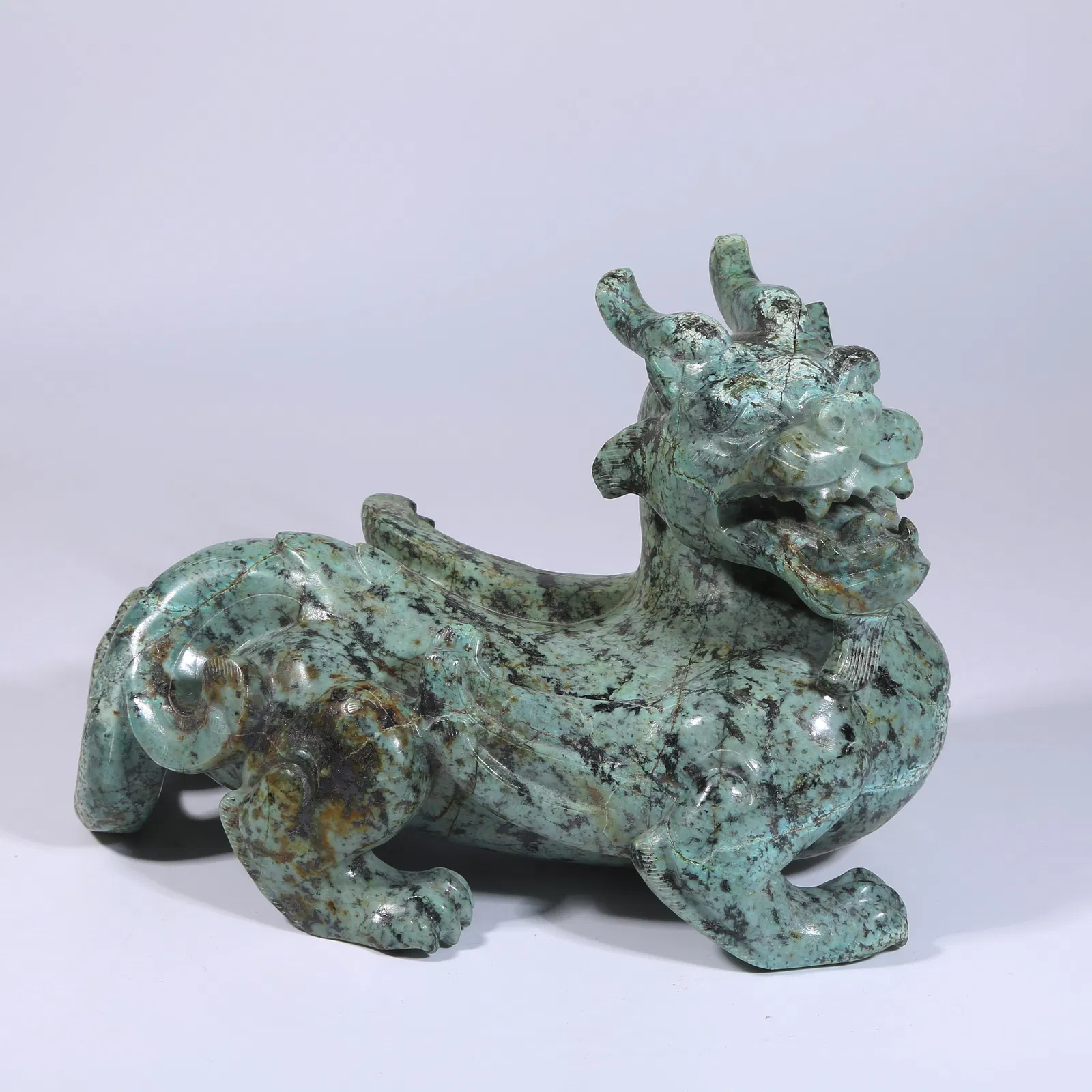 A TURQUOISE EVIL-REPELLING ORNAMENT