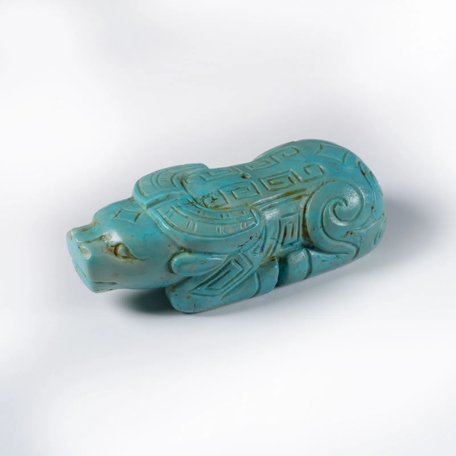 A TURQUOISE OX PENDANT