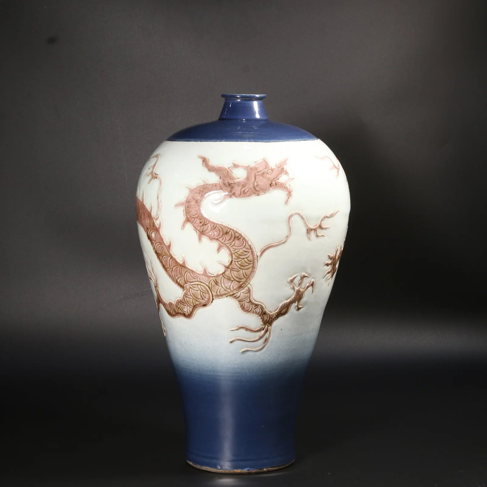 A UNDERGLAZE RED PRUNUS VASE WITH CLOUD AND DRAGON MOTIF