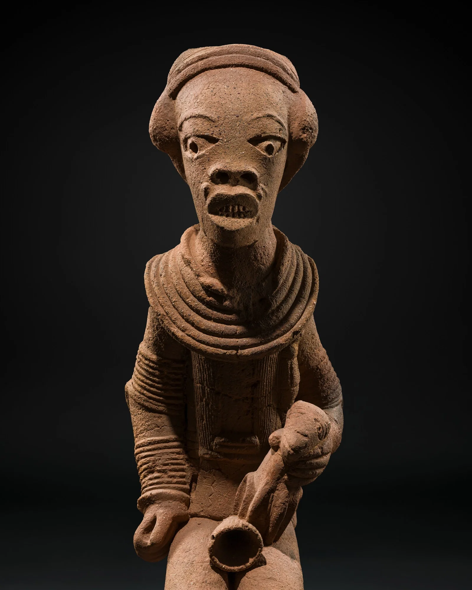 A VERY LARGE TERRACOTTA FIGURE OF A MALE DEITY, NOK CULTURE, NIGERIA, 500 BC-200 AD