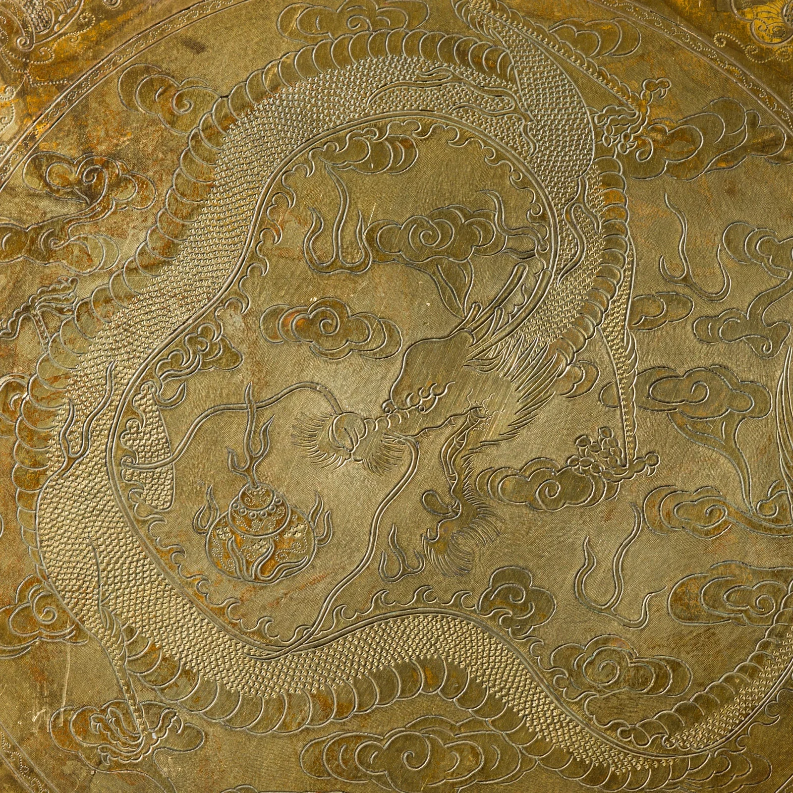 A VERY RARE AND FINELY ENGRAVED GILT-BRONZE 'DRAGON' PANEL, QIANLONG