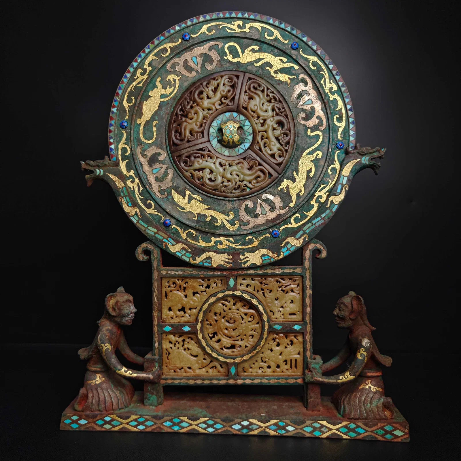A Warring States bronze - Cuo Jin Cuo silver inlaid jade turquoise kneeling bronze mirror
