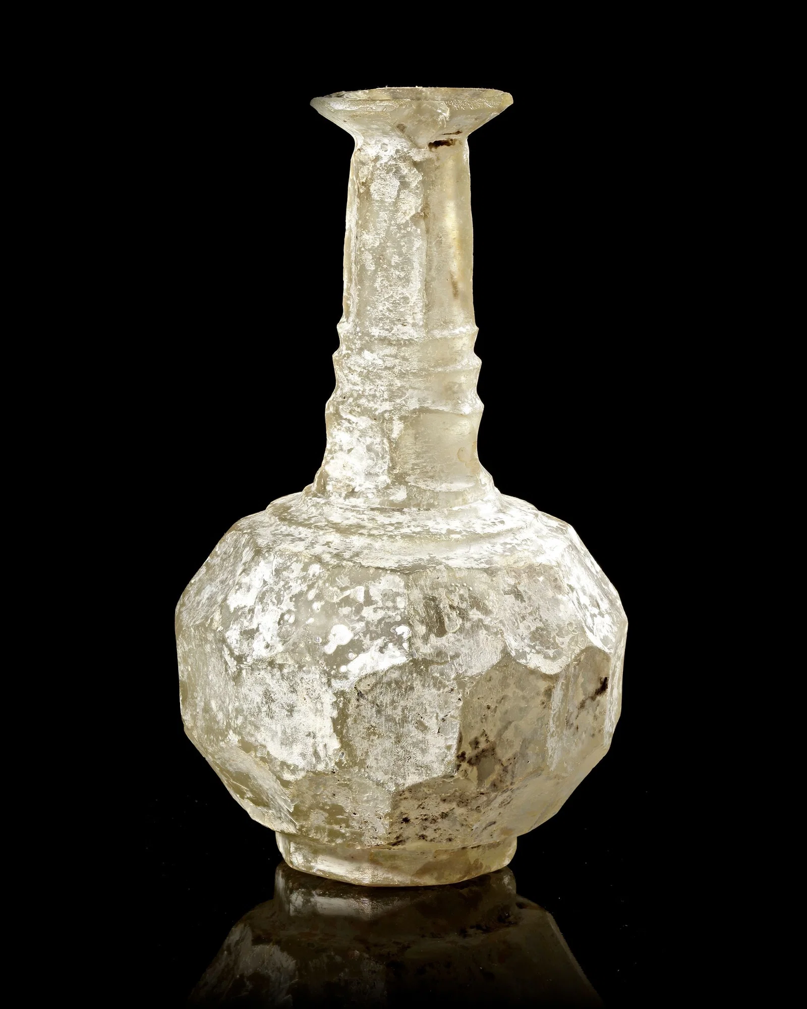 A WHEEL-CUT CLEAR GLASS BOTTLE PERSIA, CIRCA 9TH-10TH CENTURY