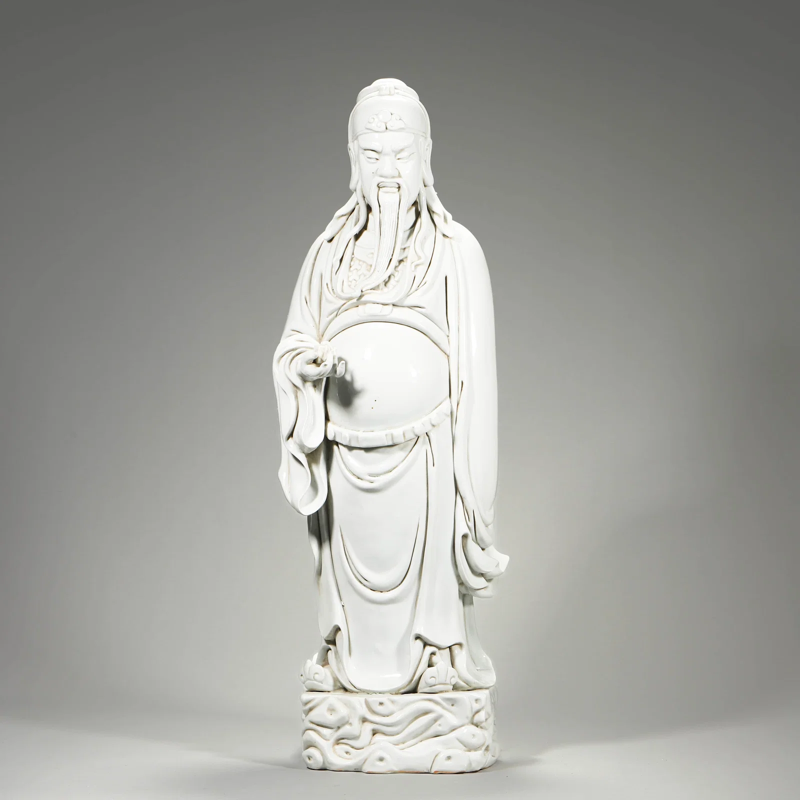 A WHITE-GLAZED FIGURE OF GUAN YU.