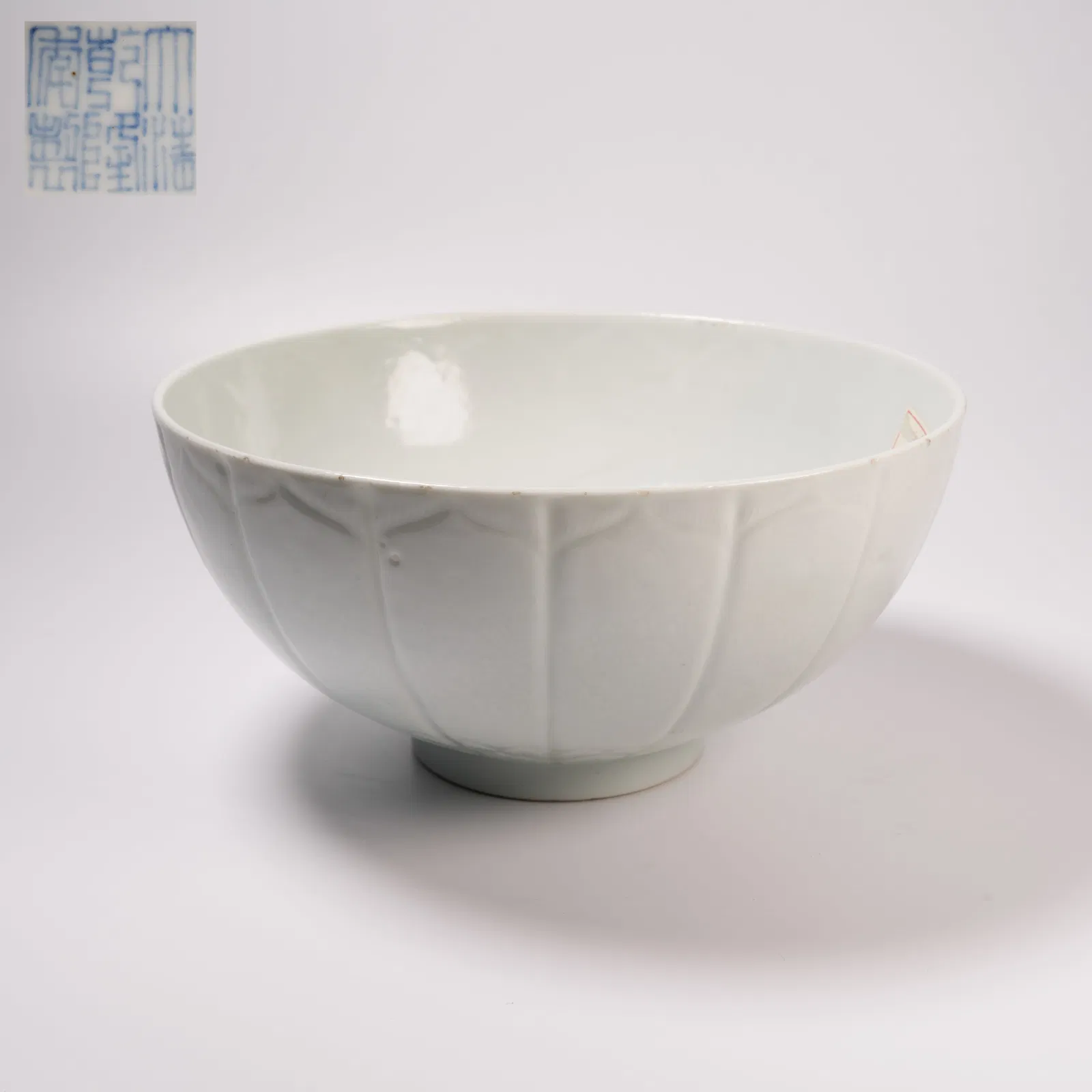 A WHITE-GLAZED LOTUS-PETAL BOWL