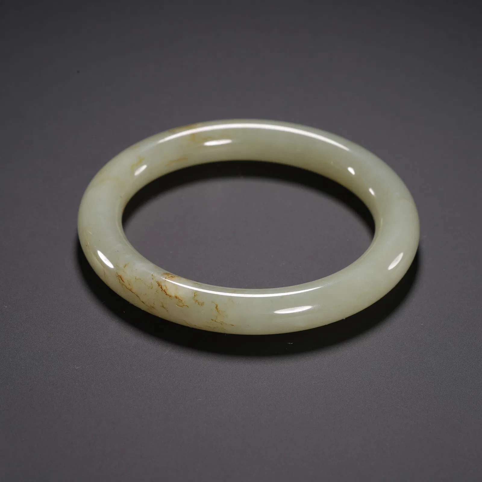 A WHITE JADE BANGLE