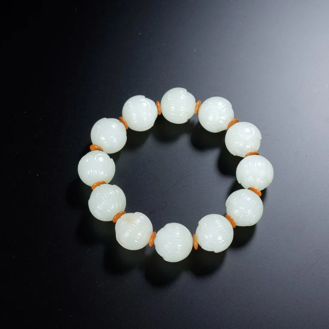 A WHITE JADE BEAD BRACELETS