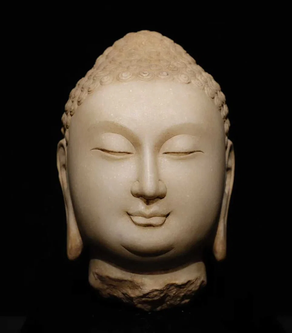 A white jade Buddha head of the Northern Qi Dynasty
