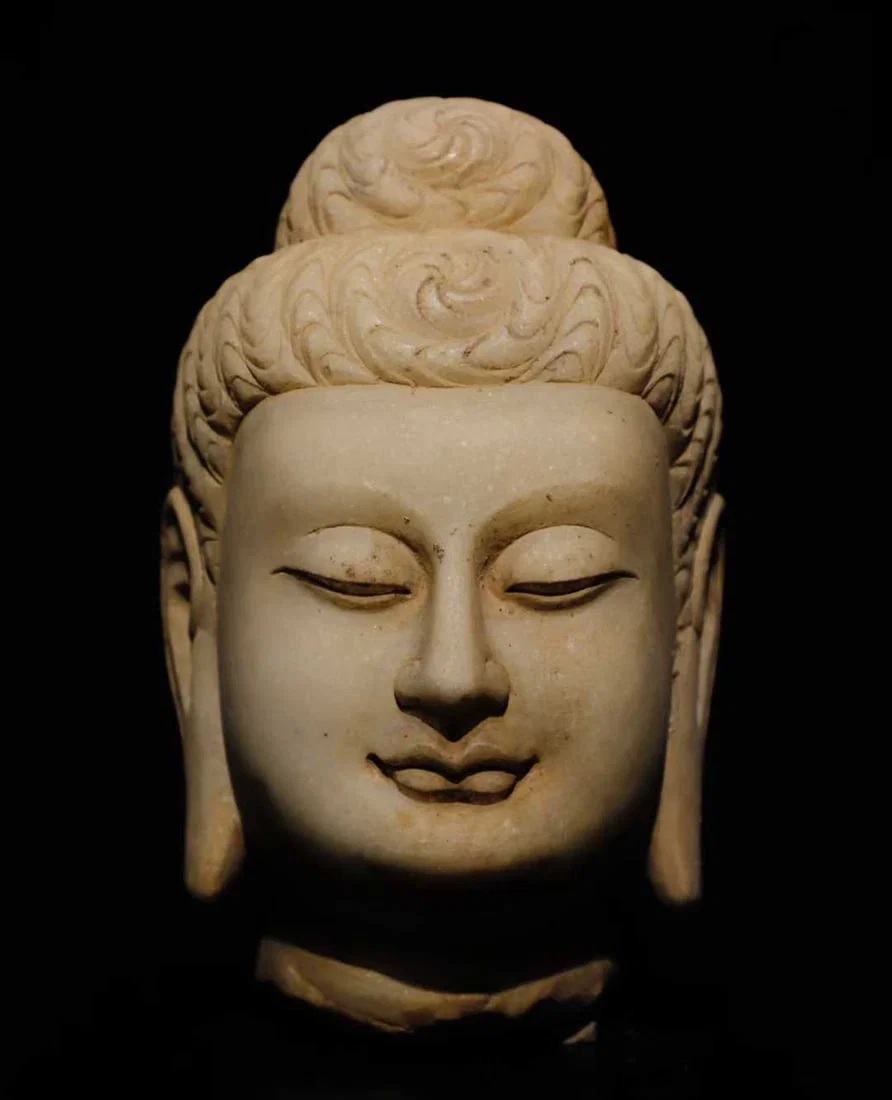 A white jade Buddha head of the Tang Dynasty